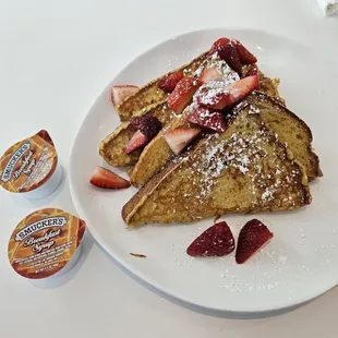 French Toast with Strawberries and Maple Syrup.