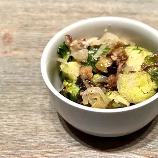 Roasted Brussels Sprouts with Turkey Bacon. Soft brussels sprouts tossed with bits of turkey bacon, roasted garlic, and sweet yellow onion.