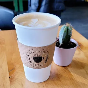a cup of coffee and a cactus