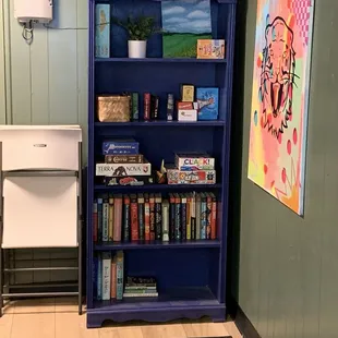 Book case in back room to use games or read.