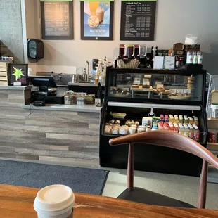 a cup of coffee on a table in a coffee shop