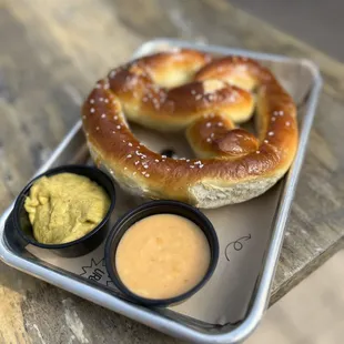 Pretzel with mustard and beer cheese