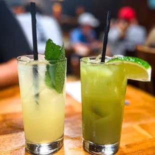 two cocktails on a wooden table