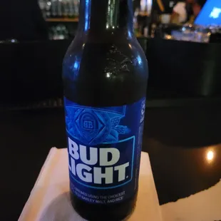 a bottle of bud light on a napkin