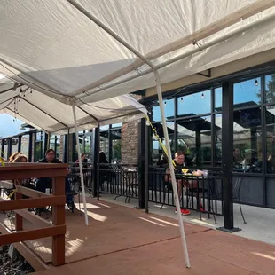 people sitting outside a restaurant