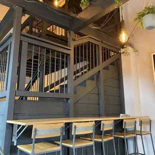 a staircase and tables in a restaurant