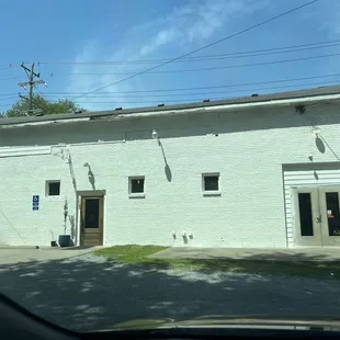 I entered through the doors on the right and another party entered through the brown door.  The lack of signage is confusing but it works.