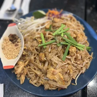 a plate of pad thai noodles