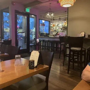 a dining area with a bar and a restaurant