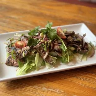 Numtok Beef = Steak wt spicy lime dressing in Thai style