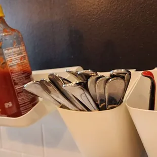 utensils and condiments on a counter