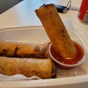 Fried eggrolls with ground pork filling.