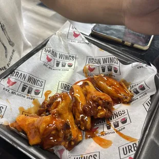 a tray of wings on a table