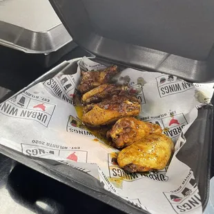 grilled wings in a paper wrapper