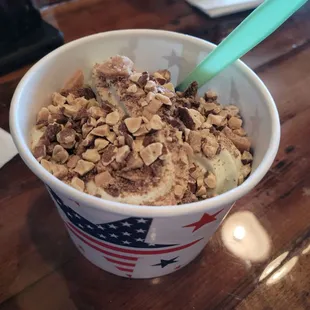 Mint chocolate chip frozen yogurt with 1 scoop heath bar and 1 scoop roasted almonds