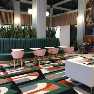 seating and tables in a brightly colored lobby
