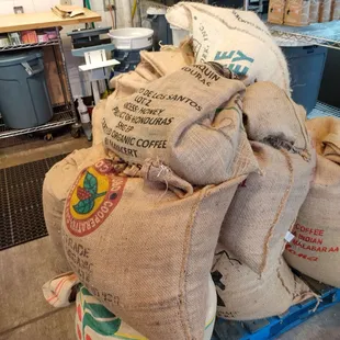 a stack of bags of coffee beans