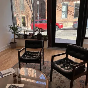 a coffee table and chairs in a coffee shop