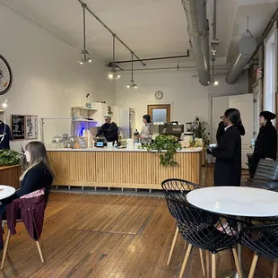 a group of people in a cafe