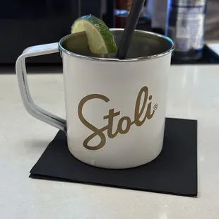 a mug with a drink in it