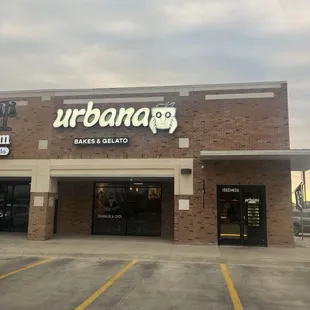 the outside of a store with a sign on the front of it