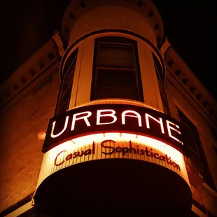a neon sign on a building at night