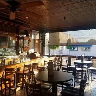 Main bar with seating along a window that opens up