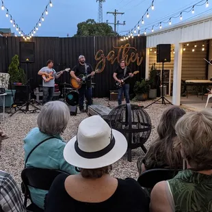 a group of people sitting outside