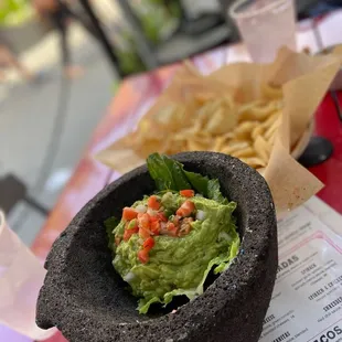 guacamole and chips on a table