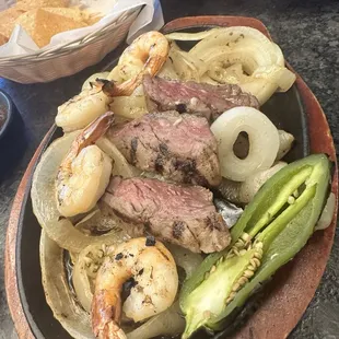 Shrimp and steak fajitas with big ass onion slices.  It was quite funny in person.
