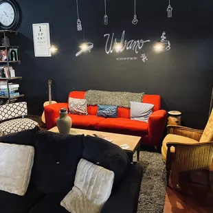 a living room with a red couch