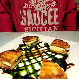 Heaven In Your Mouth Caprese S'mores with melted mozzarella between toasted crostini with tomato jam and balsamic syrup