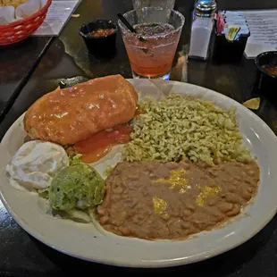 Shredded chicken chimichanga w/ ranchero sauce and poblano rice &amp; refried beans