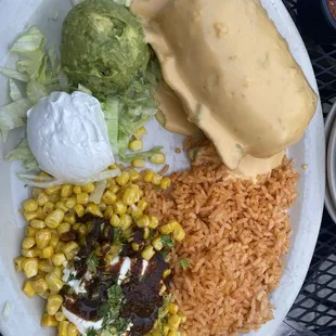 Chimichanga with brisket and queso, side of rice and street corn