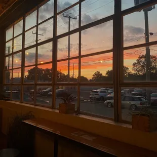 a sunset through a window