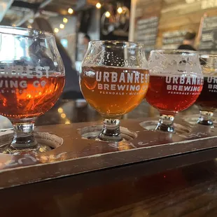 a flight of beer glasses