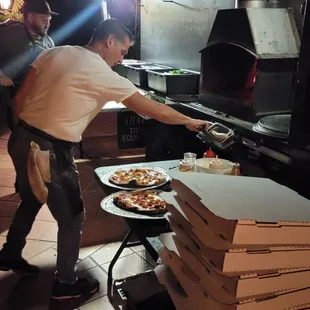 Joe making sure the pizzas were non-stop!