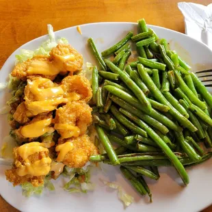 Firecracker shrimp bowl w/ green beans on the side.