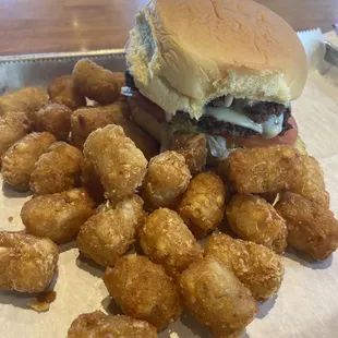 Smash burger w/ lettuce and tomatoes added and tater Tots