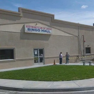 people standing outside of a building