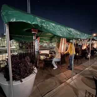 Outside seating area to the left of the restaurant entrance