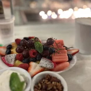 Half Fresh Fruit Plate with whipped cream and granola