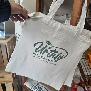 a person holding a tote bag