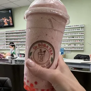 Having my favorite (Strawberry Snow Smoothie with Strawberry Boba while getting my pedicure at Hannah Nails.