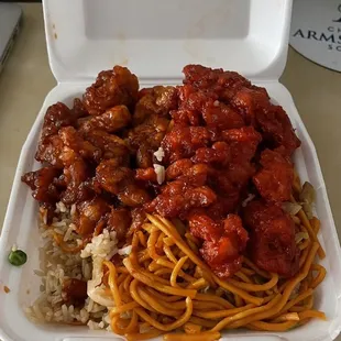 a takeout container with noodles and meat