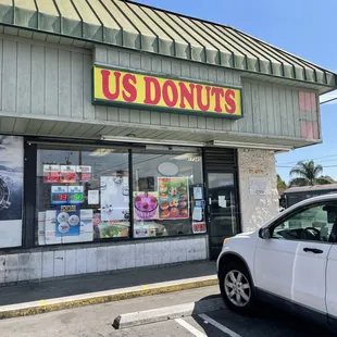 a car parked in front of a donut shop