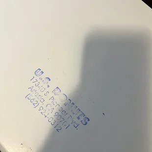 a white box with blue writing on it