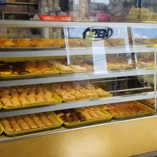 a display case filled with donuts