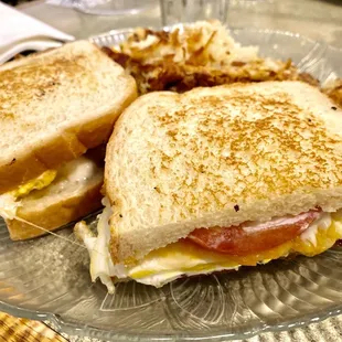 Breakfast sandwich on sourdough, yum!!!! Plenty of bacon, just can&apos;t see it.