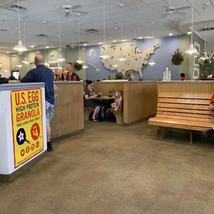 people sitting at tables in a restaurant